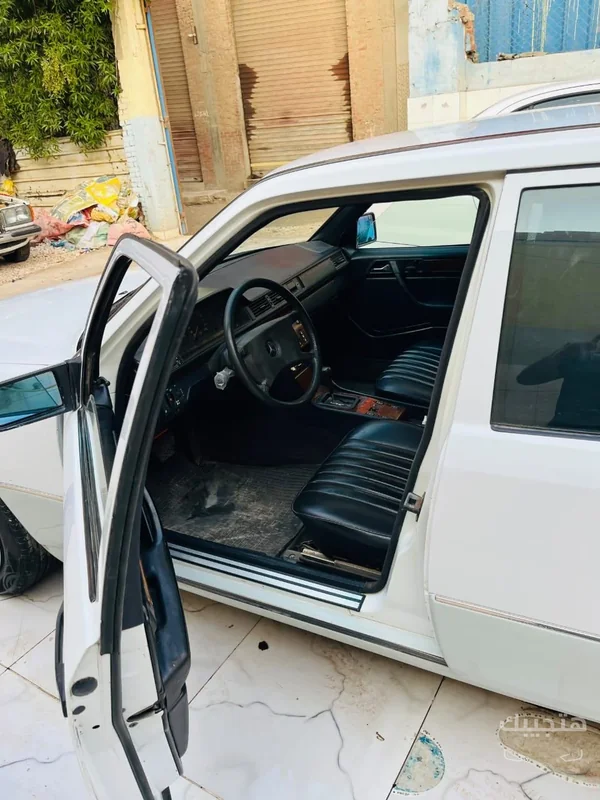 Interior and side view of 1990 Mercedes-Benz E200