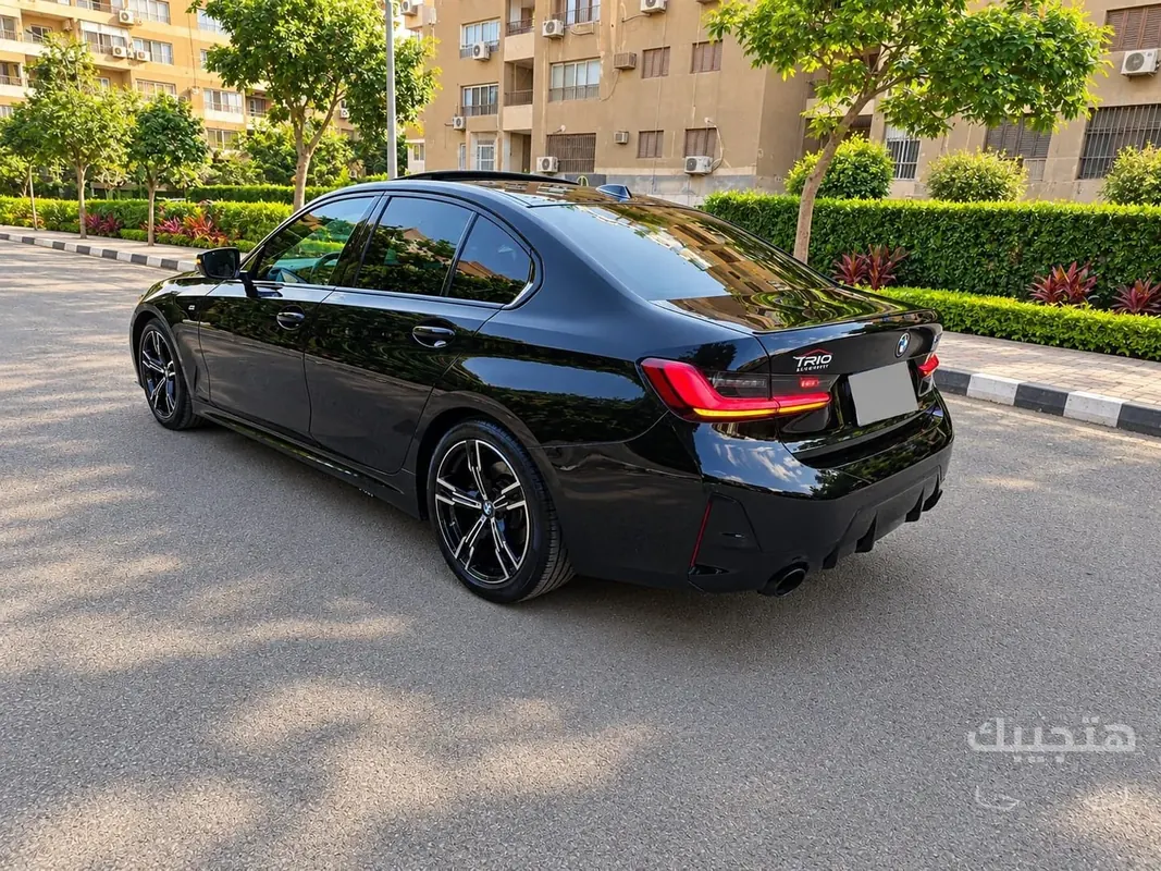 Rear and side view of 2024 BMW 320i