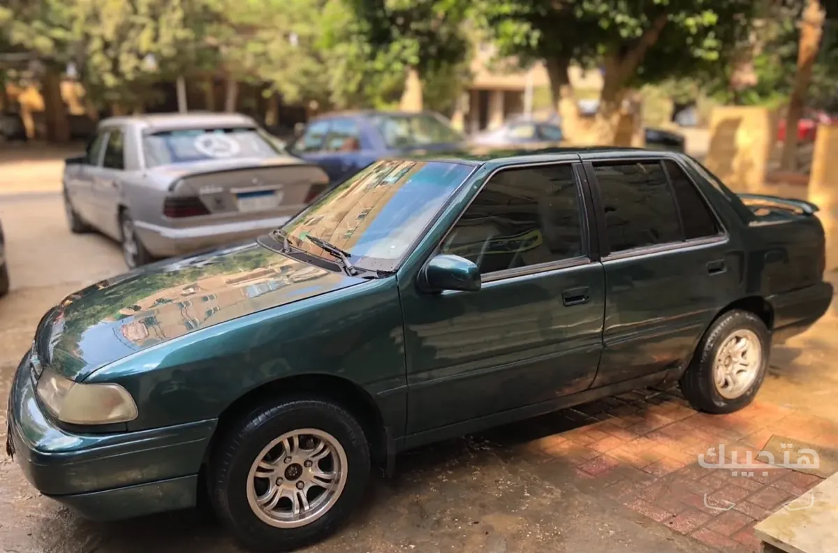 Front, side and interior view of 1997 Hyundai Excel