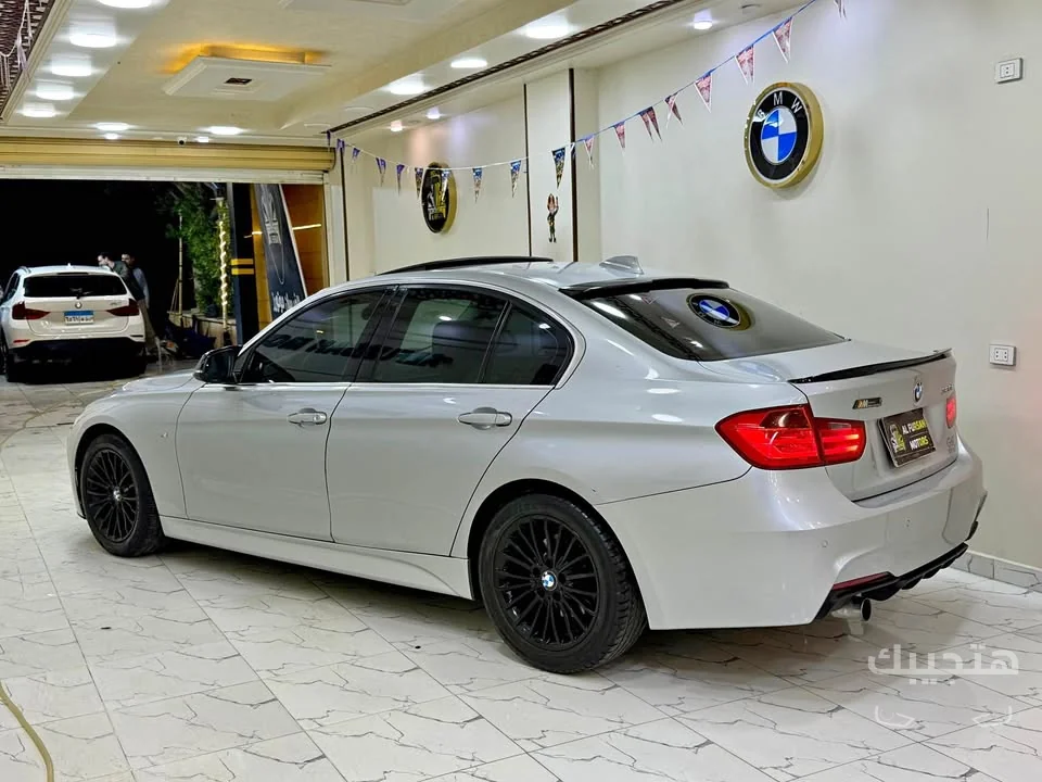 side and rear view of 2013 BMW 320i
