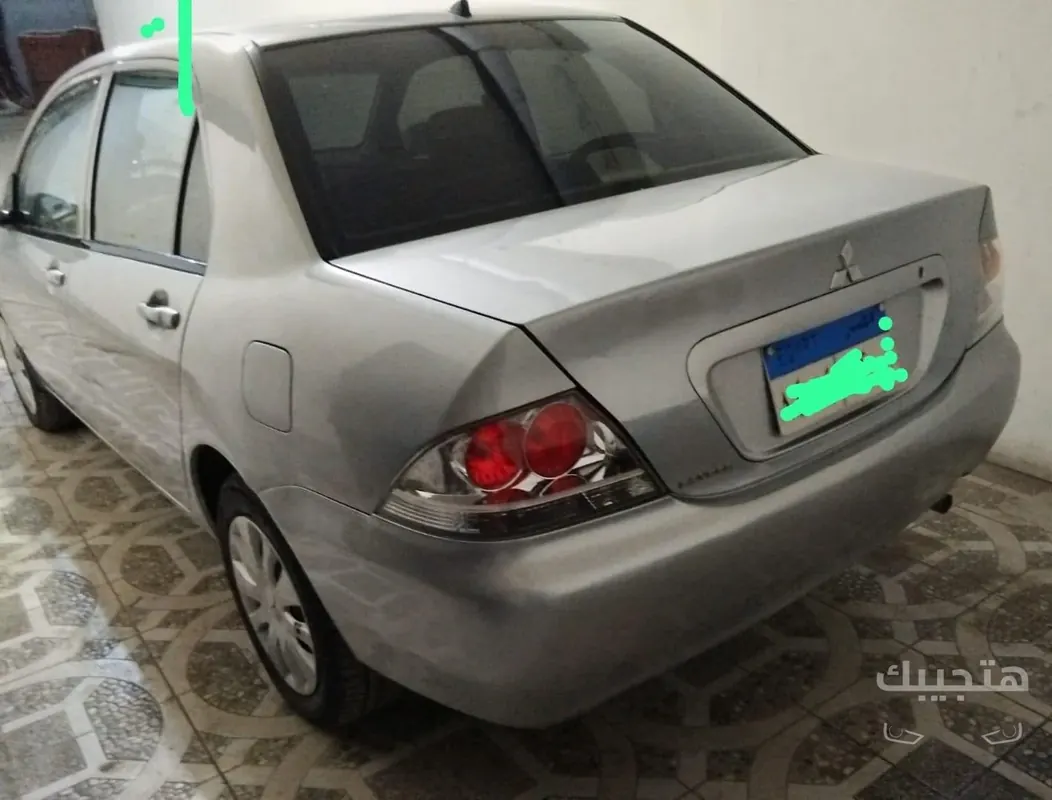 Rear and side view of 2014 Mitsubishi Lancer