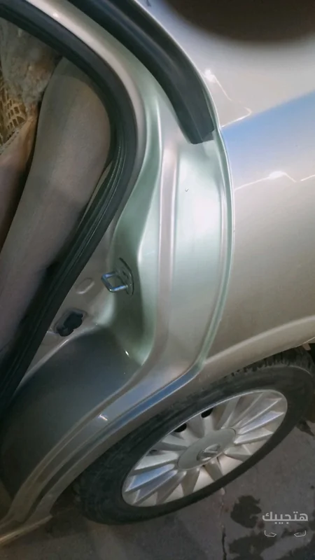 side view of 2009 Nissan Sunny