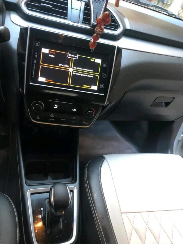 Interior and dashboard view of 2024 Suzuki Dzire
