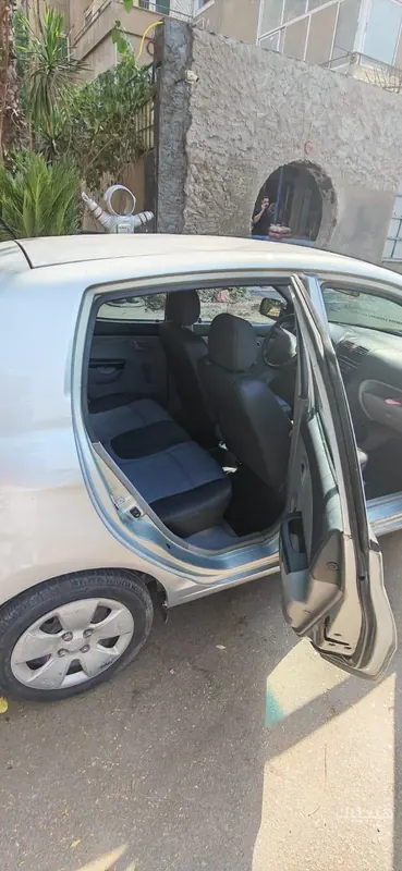 Interior, side and front view of 2007 Kia Picanto