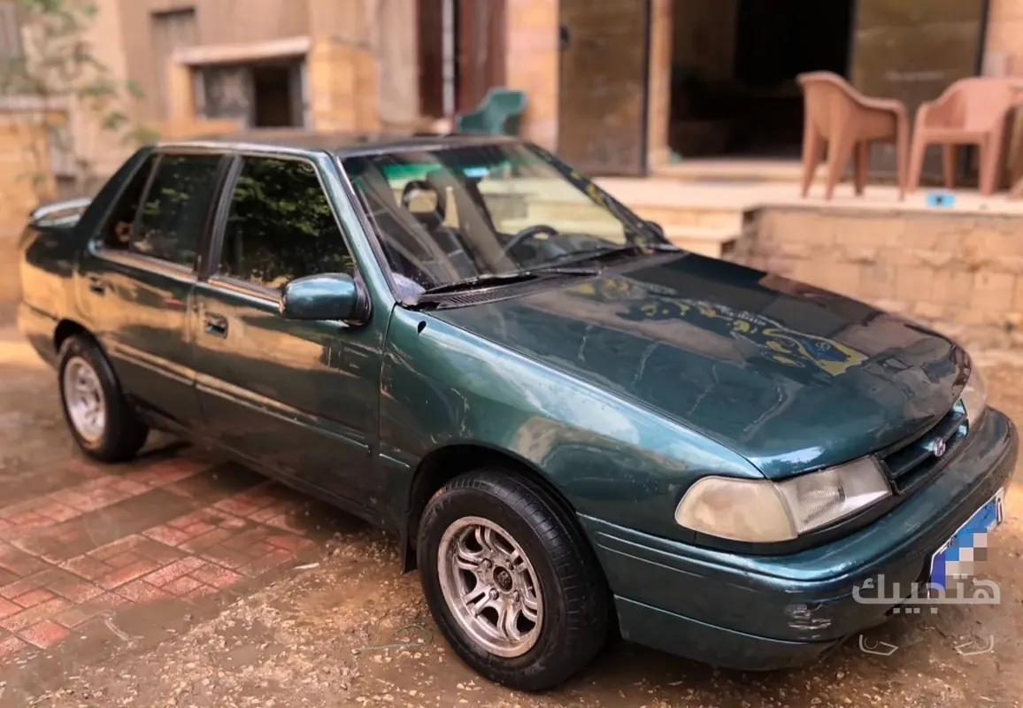 Front, side and interior view of 1997 Hyundai Excel